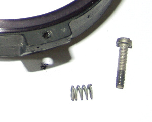 The main collimating bolt and spring