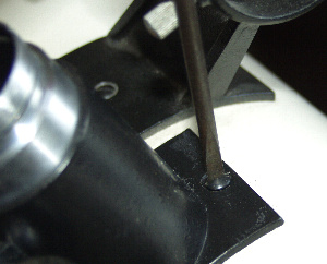 The focuser retaining screws being removed