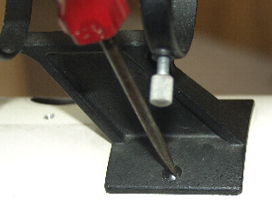 The finder scope bracket retaining screws