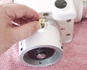 Fully remove the DEC clutch bolt from the mount along with the small brass button. If the button cannot be removed easily then ignore it. It can be extracted easily later in the procedure.